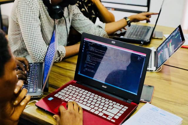 Software developers working on laptops